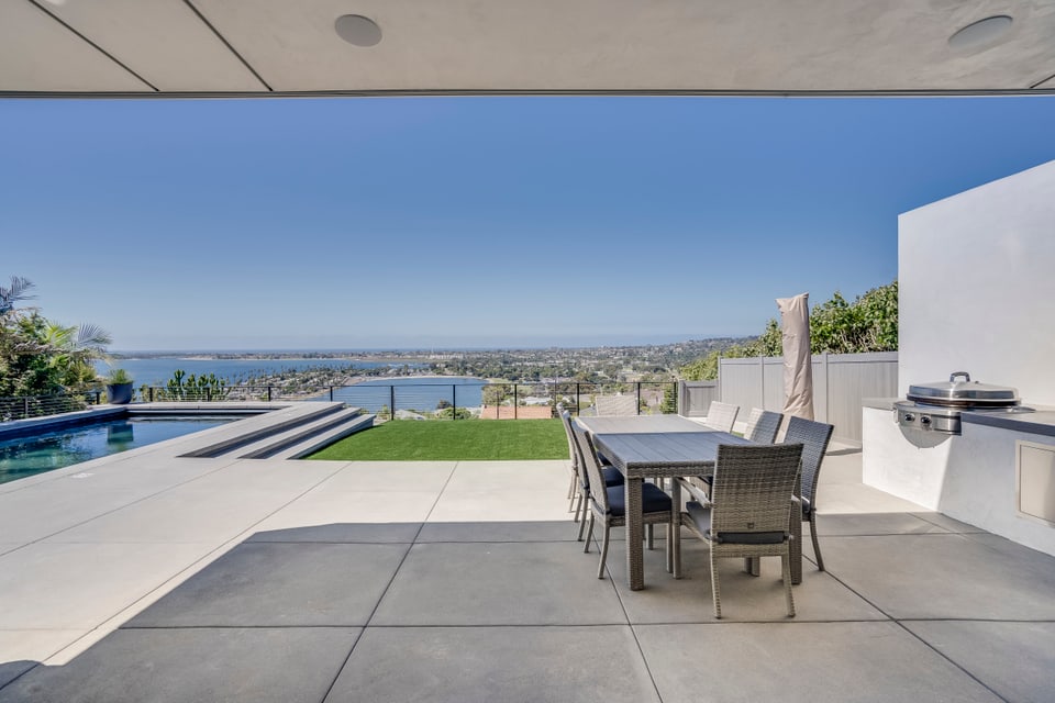 Donley hillside terrace, pool, and coastal view