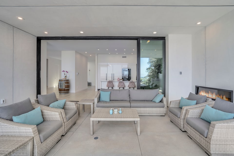 Donley indoor-outdoor living area with linear fireplace